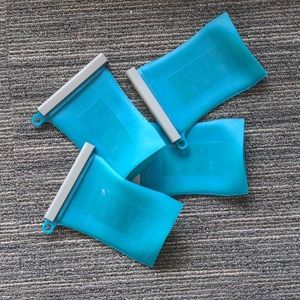 Junobie teal silicone breast milk storage containers